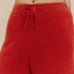 Woman in fuzzy red shorts