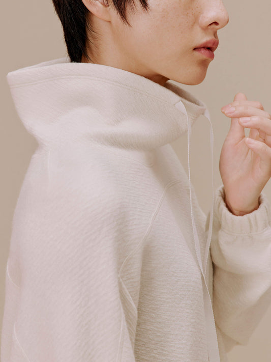 Woman in white pullover