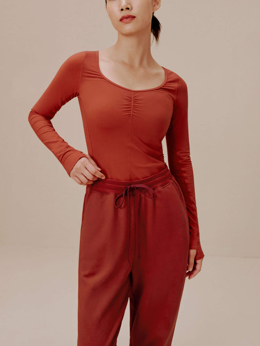 Woman in red top and sweatpants