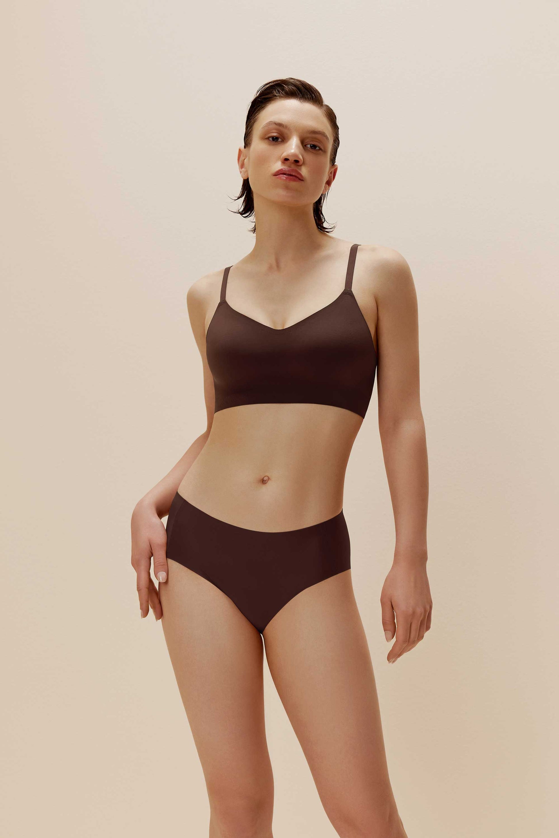 women in brown bra and brief