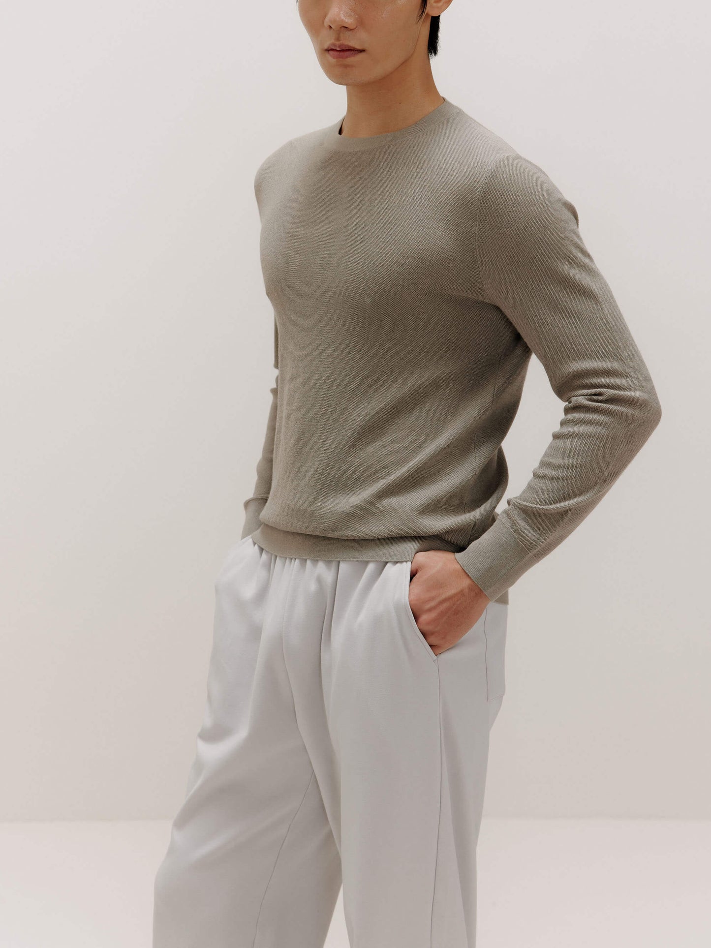 man in khaki sweater