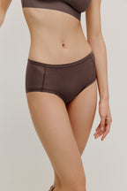 woman in dark purple brief