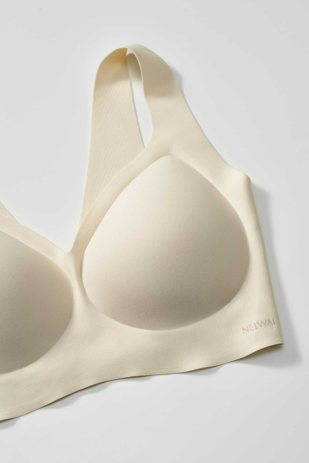 close up of a light yellow bra