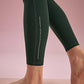 ankle detail of the green leggings shown neiwai active logo
