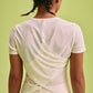 back of a woman wearing white Cross-back T-Shirt and a hat 