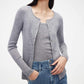 woman in grey cardigan