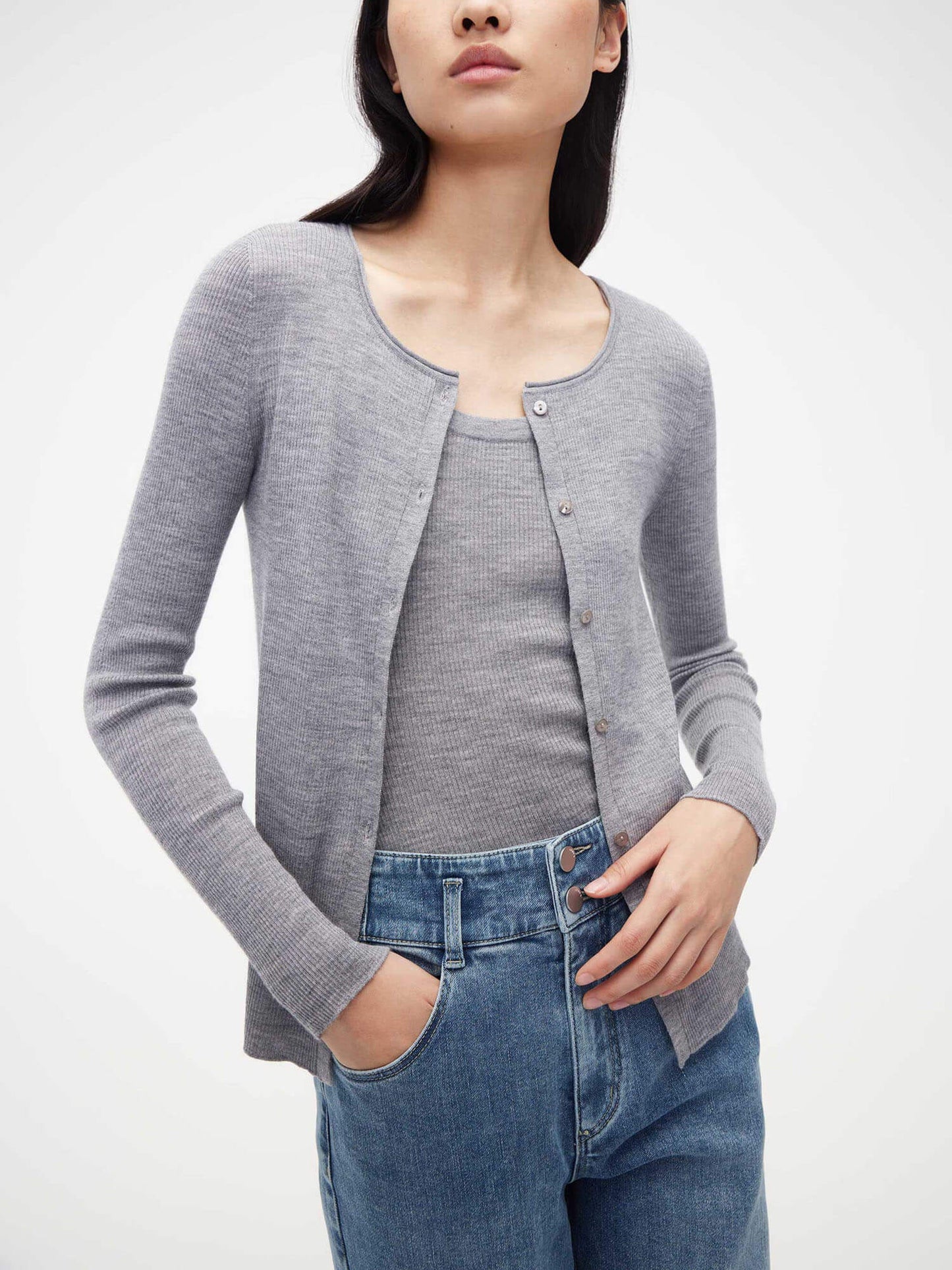 woman in grey cardigan