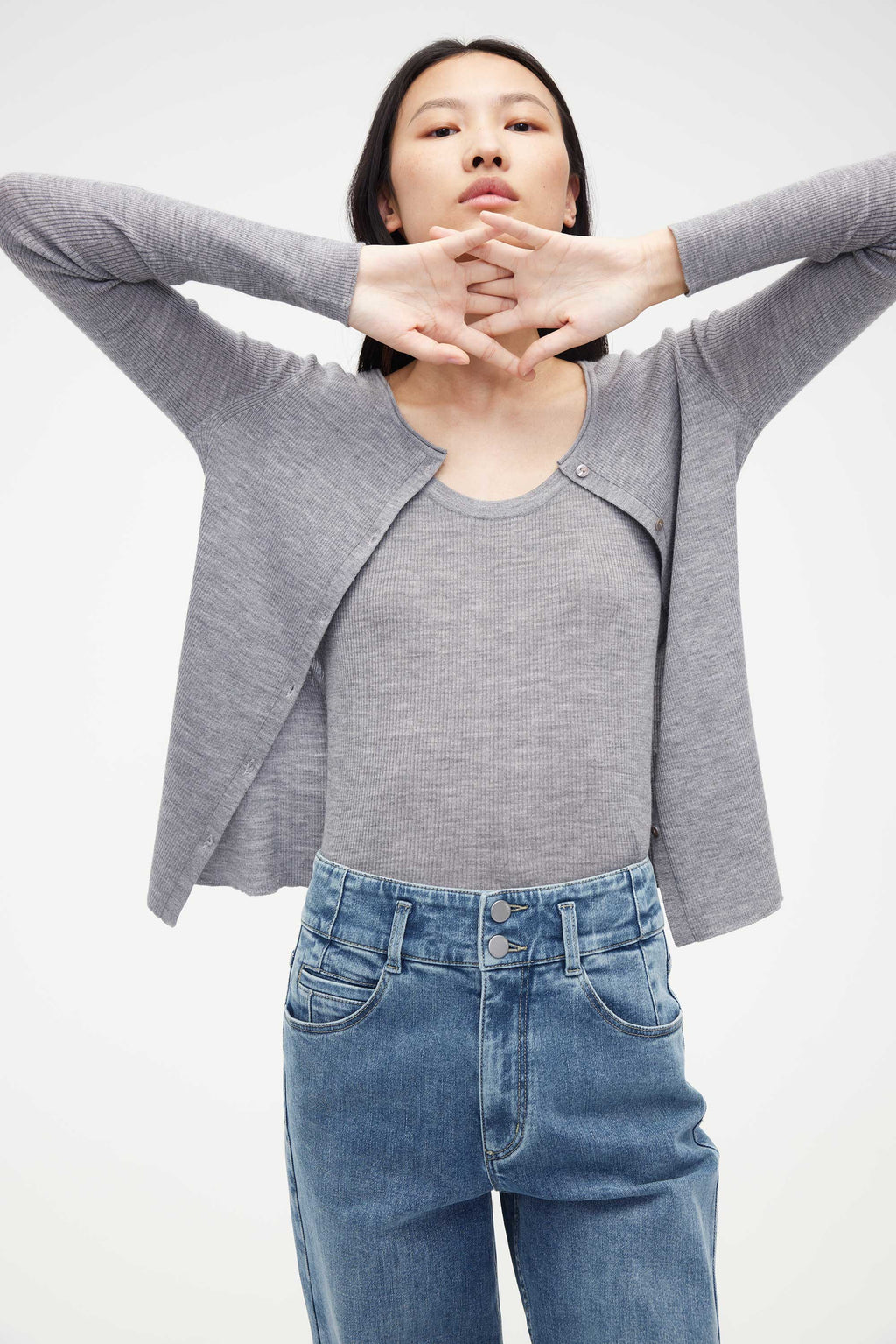 woman in grey cardigan with matching under layer