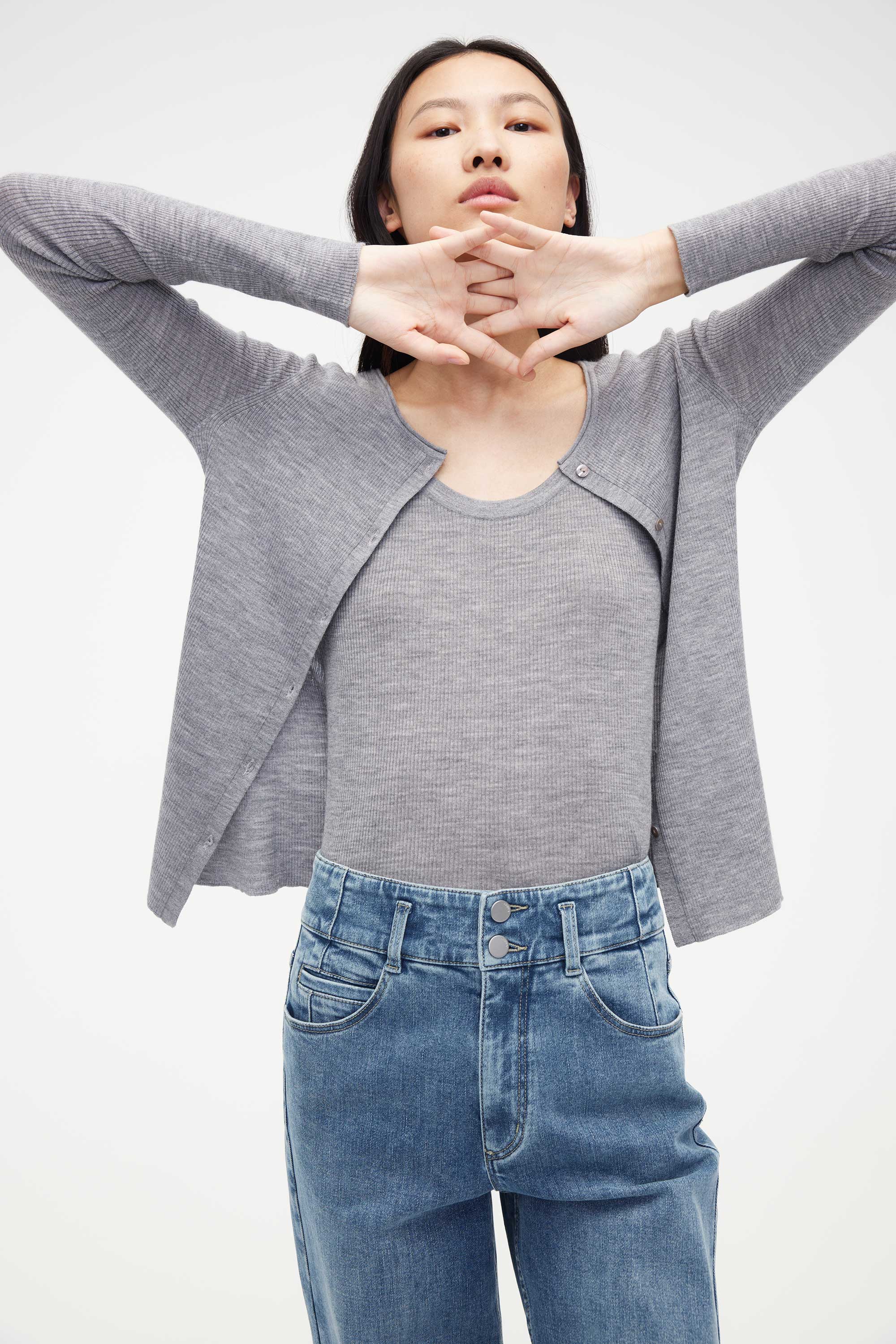woman in grey cardigan with matching under layer
