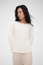 woman in cream pajama t-shirt