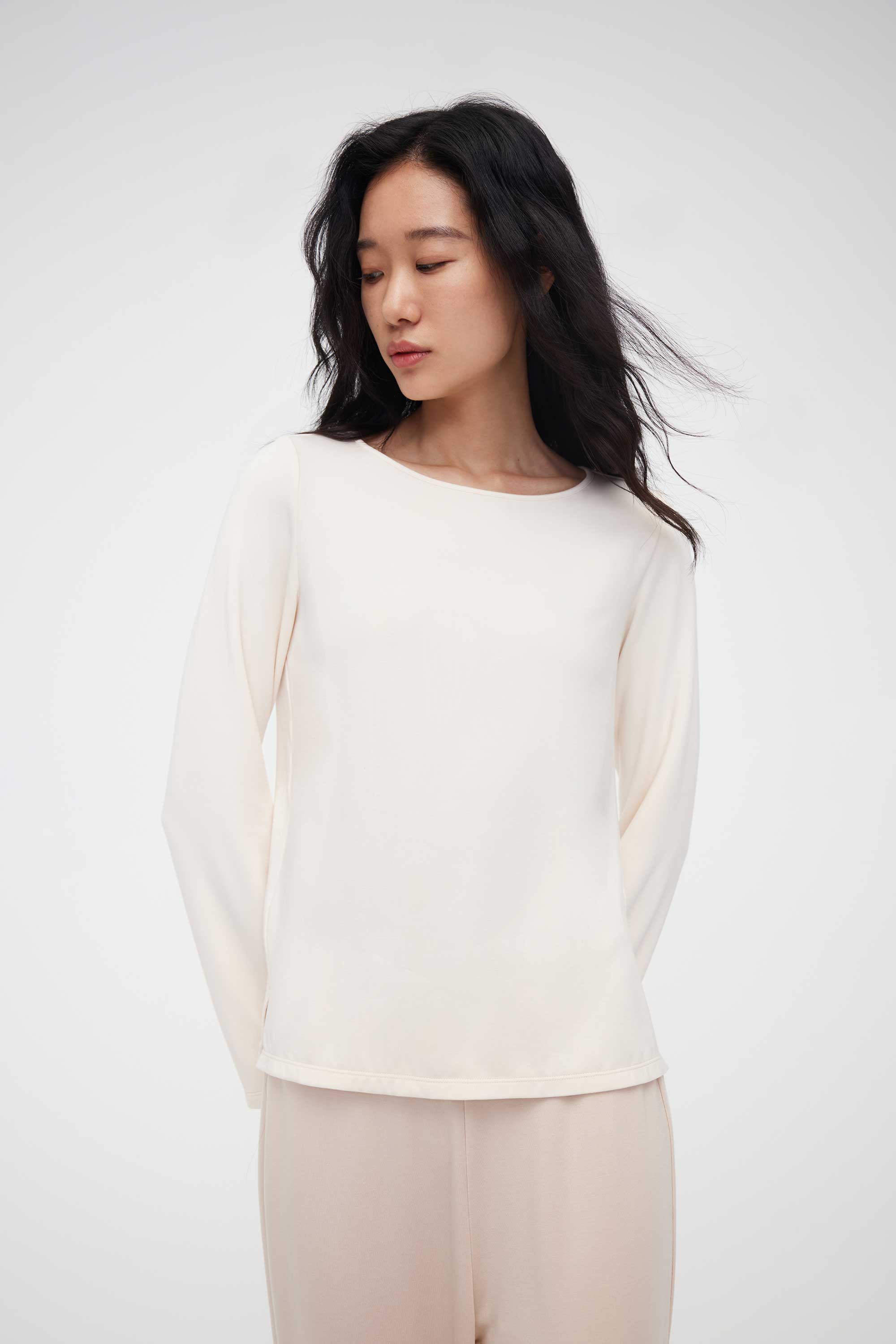 woman in cream pajama t-shirt