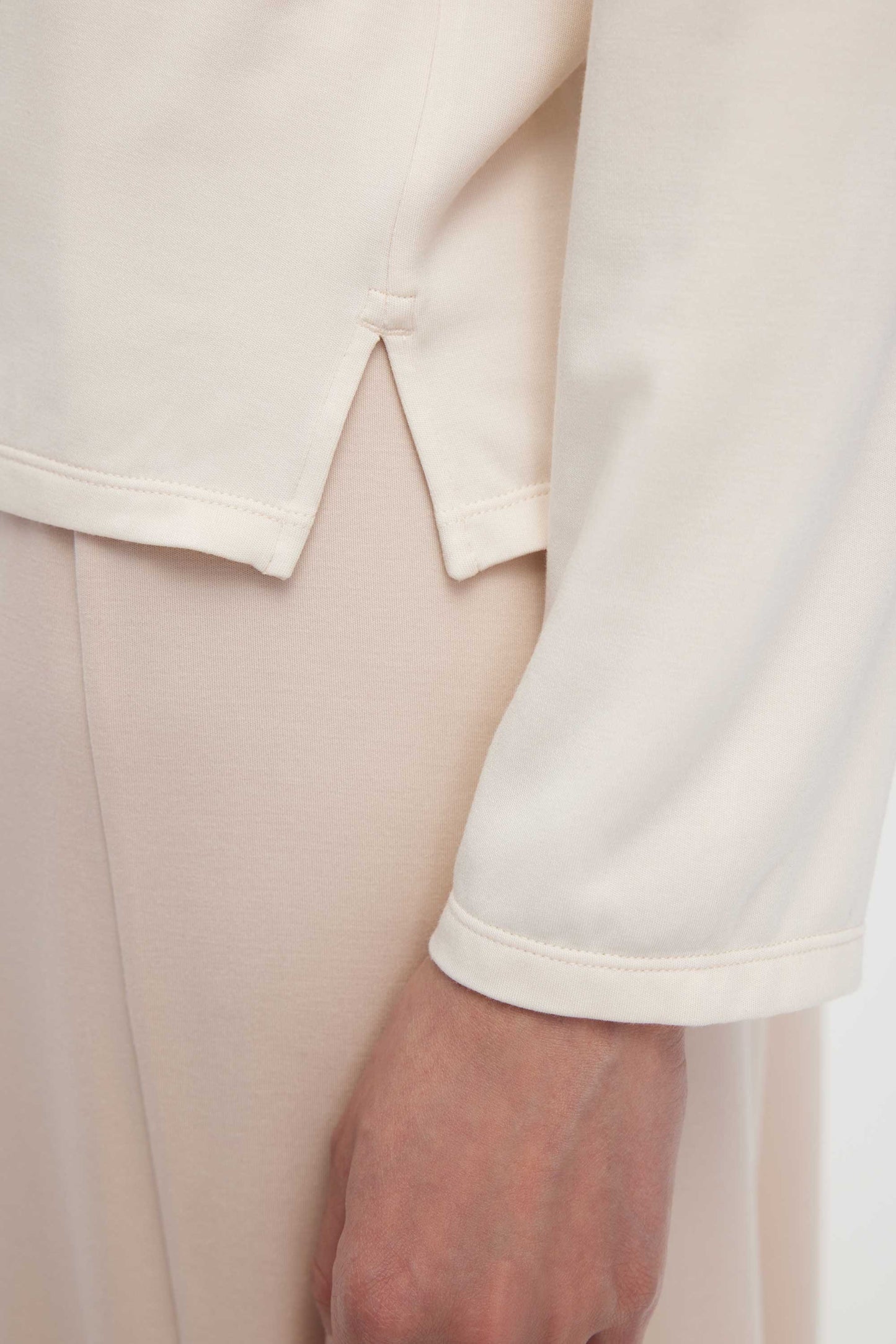 close up of cream pajama tee hems