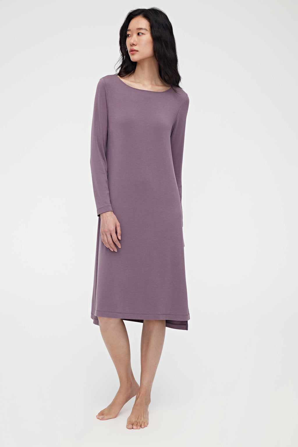 woman wearing a purple pajama dress