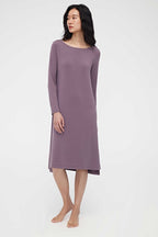 woman wearing a purple pajama dress