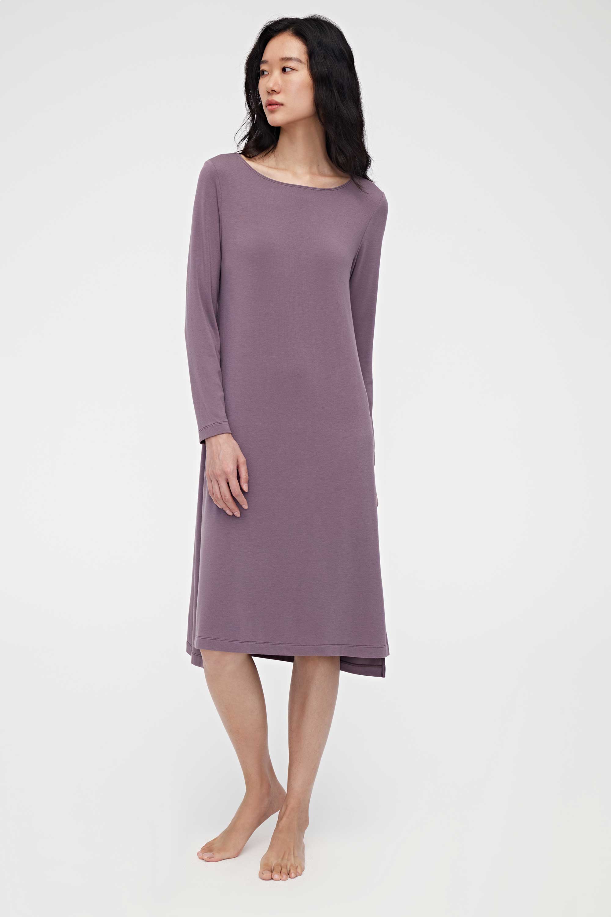 woman wearing a purple pajama dress