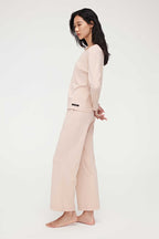 side look of woman in pink lounge t-shirt and pants
