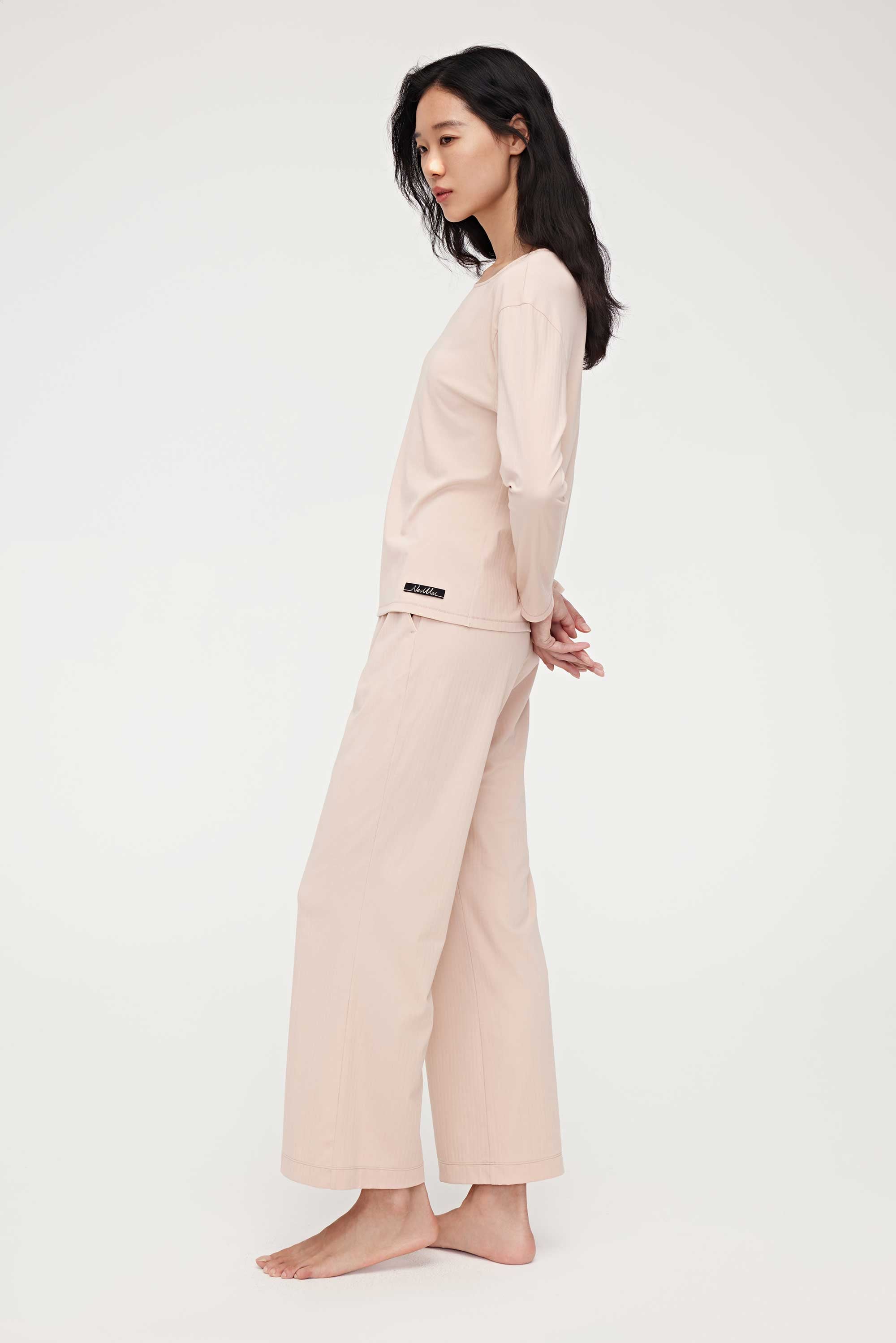 side look of woman in pink lounge t-shirt and pants