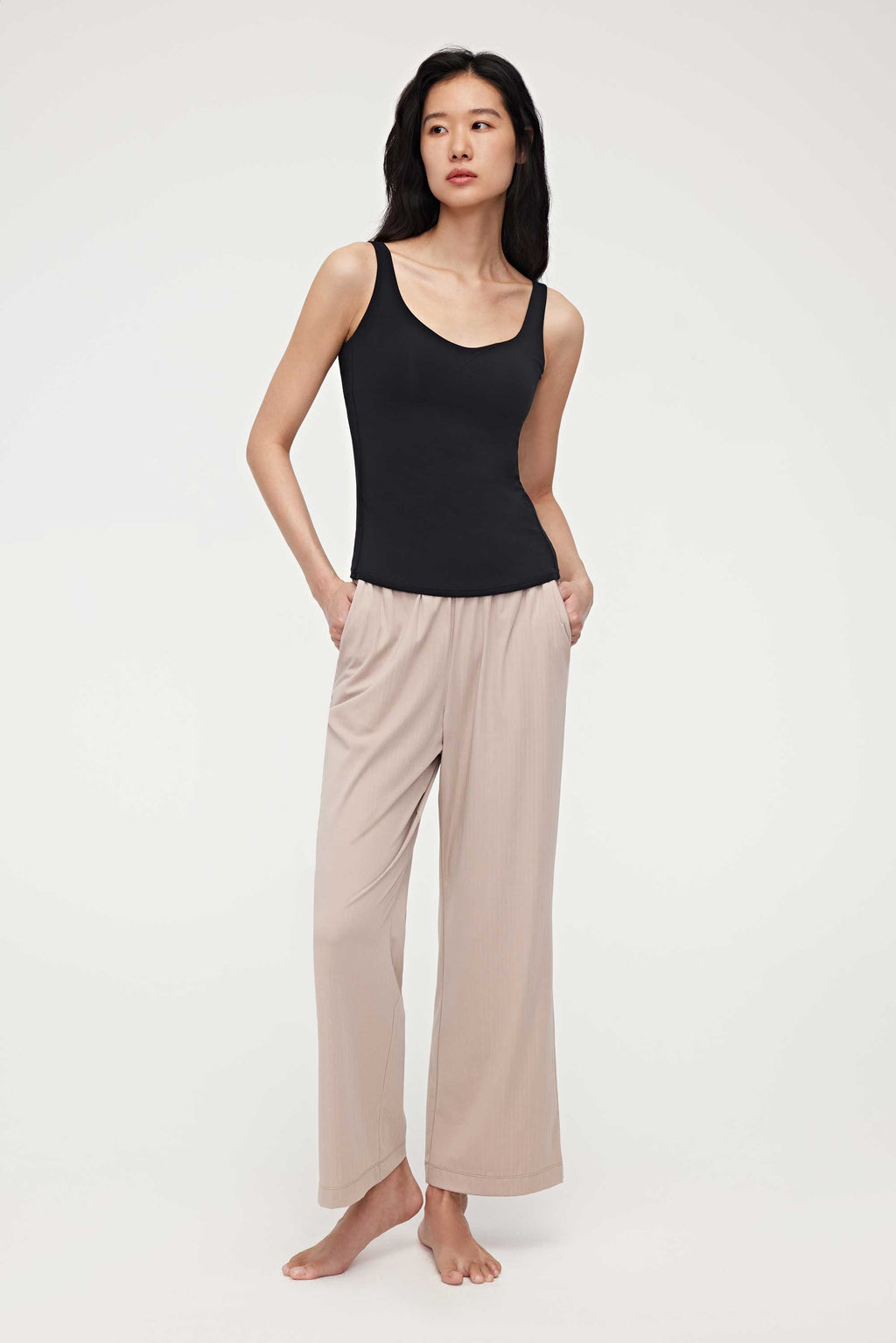woman in black tank top and coffee lounge pants