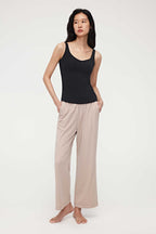 woman in black tank top and coffee lounge pants