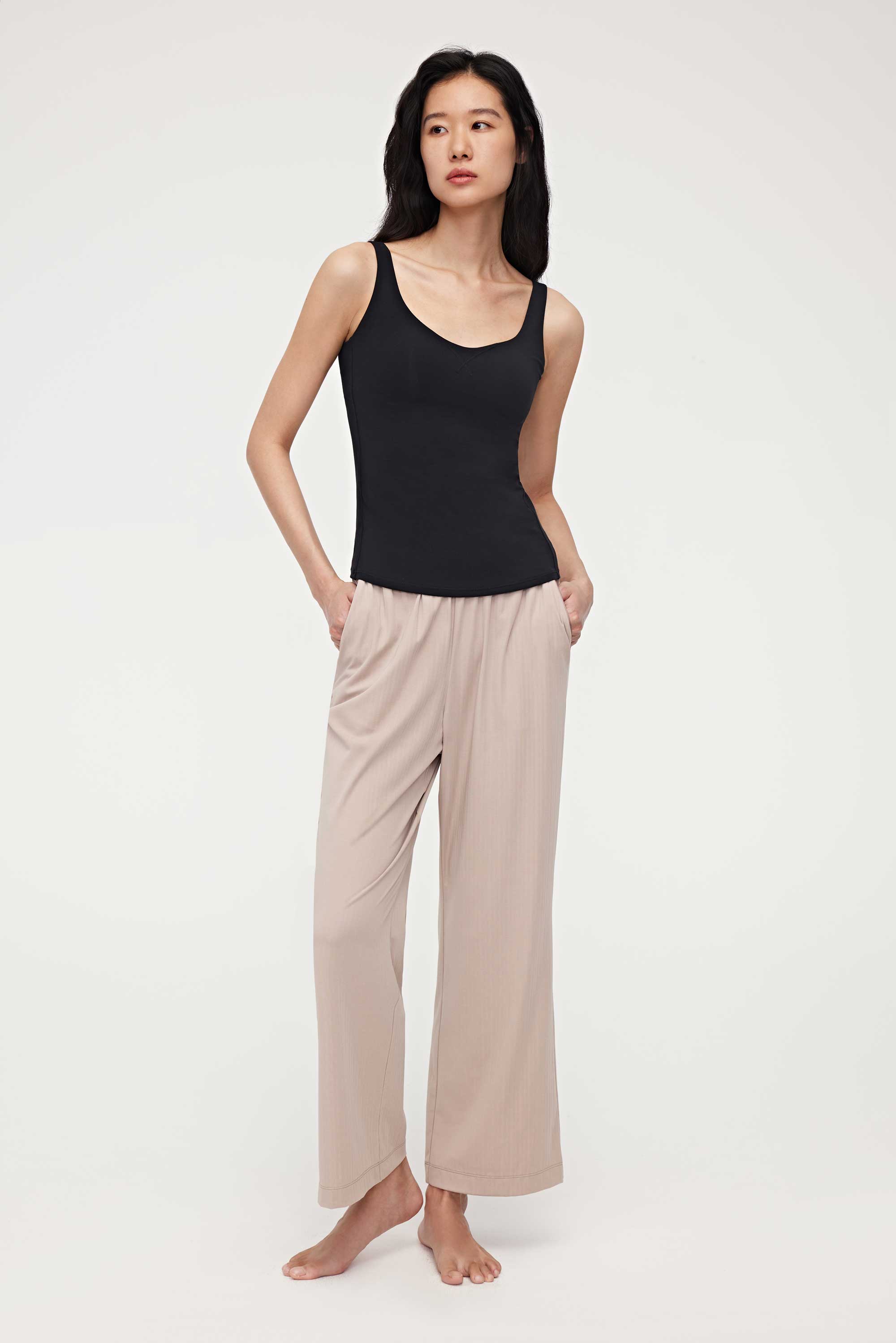 woman in black tank top and coffee lounge pants