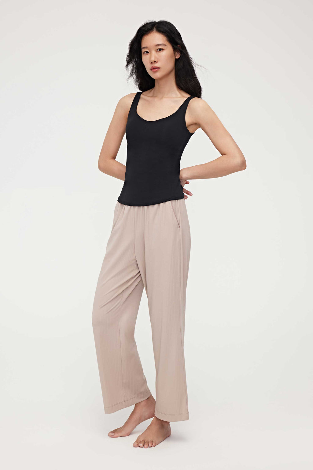 woman in black tank top and coffee lounge pants