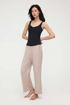 woman in black tank top and coffee lounge pants