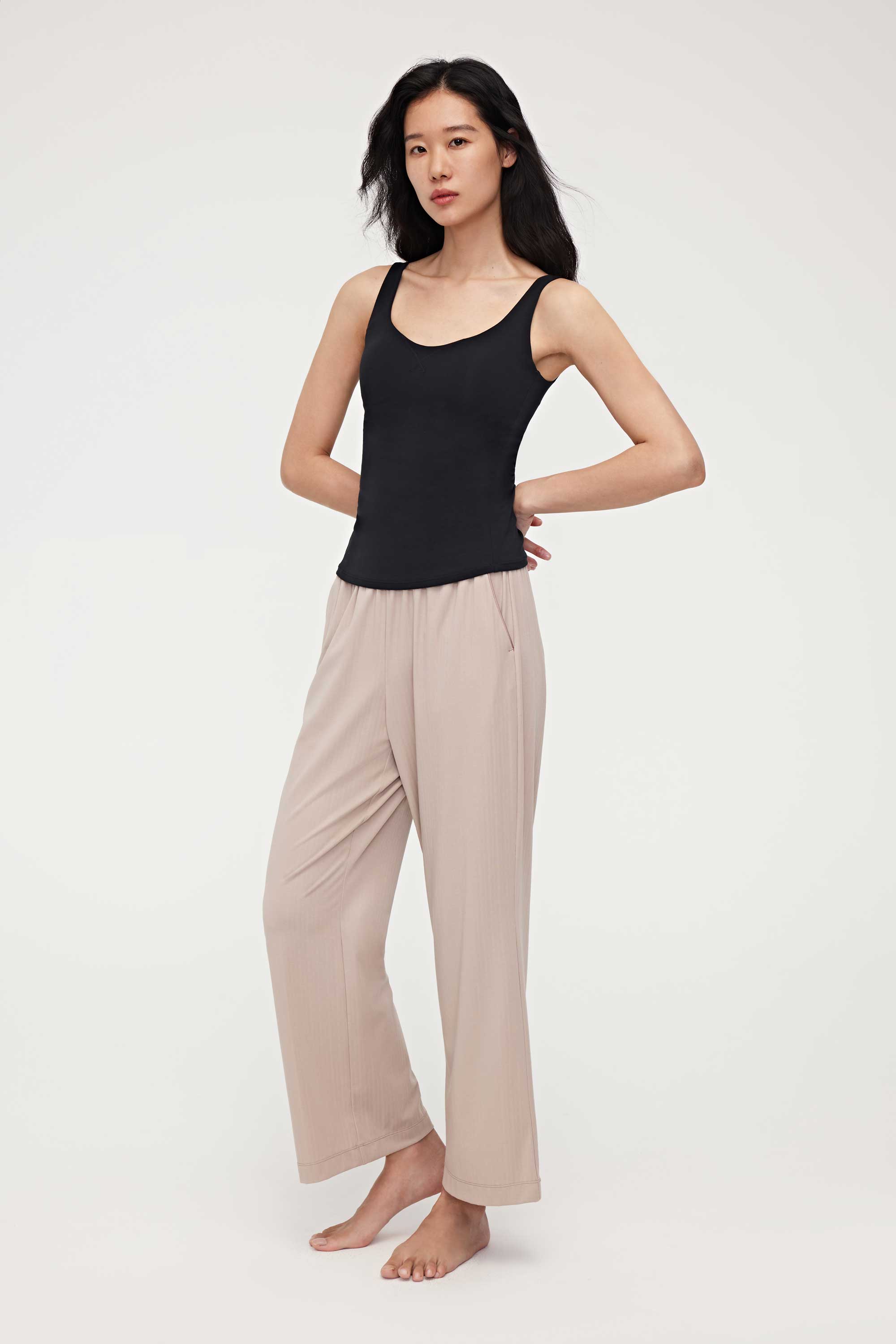 woman in black tank top and coffee lounge pants