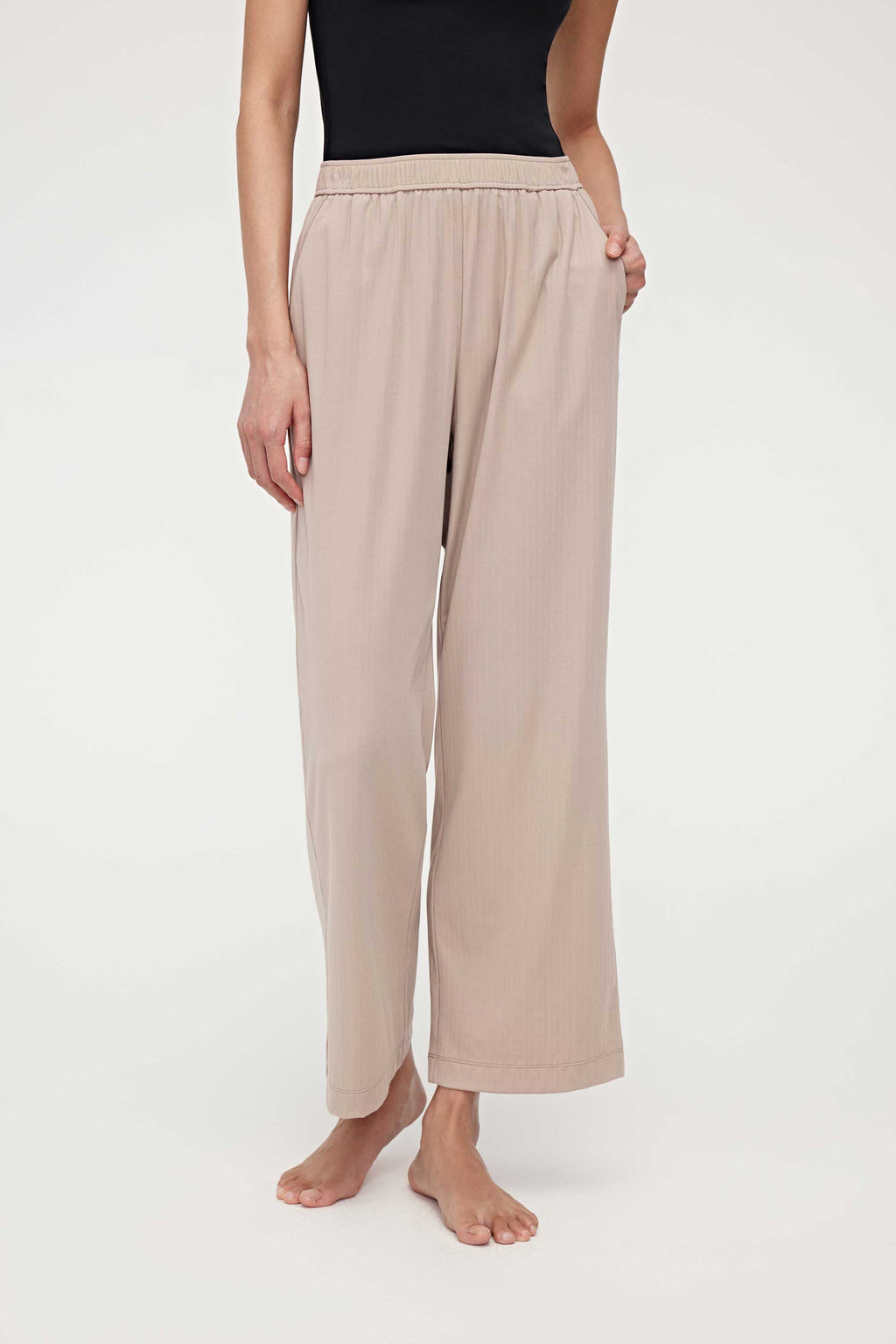 woman in black tank top and coffee lounge pants