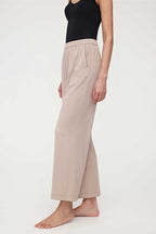 woman in black tank top and coffee lounge pants