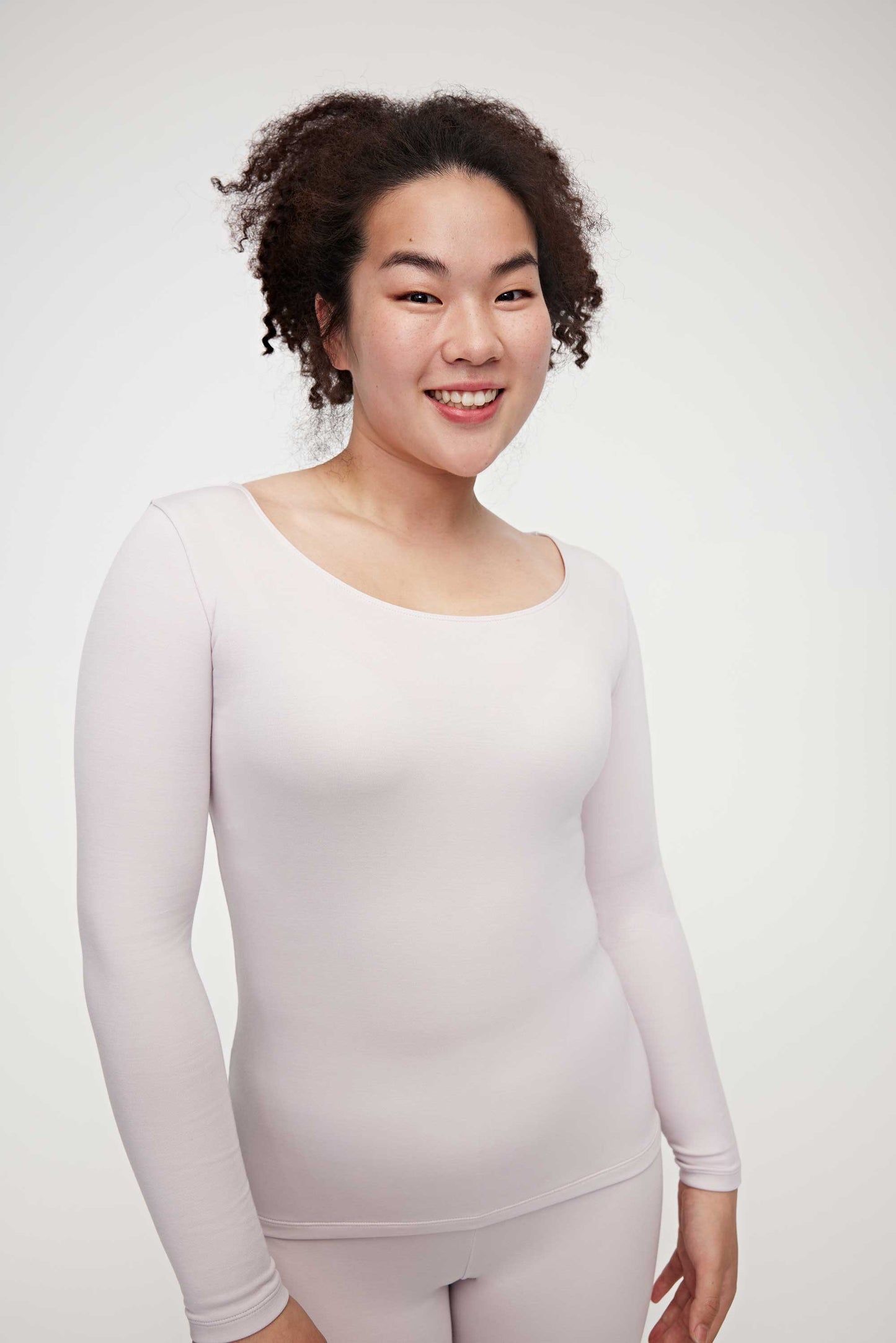 woman in light pink thermal top