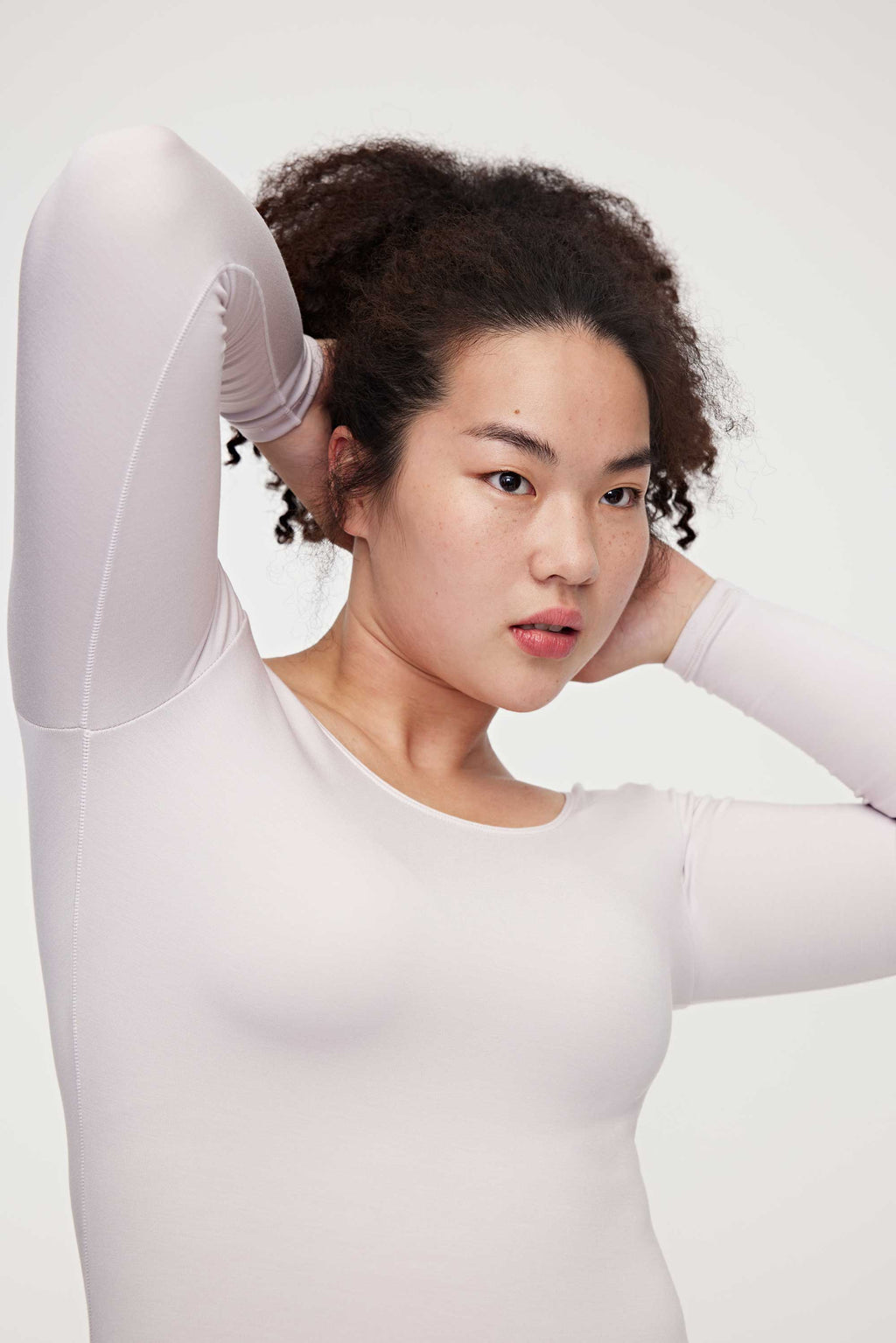 woman in light pink thermal top