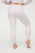 back of woman in light pink thermal pants