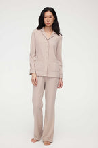 woman in coffee button up pajama set