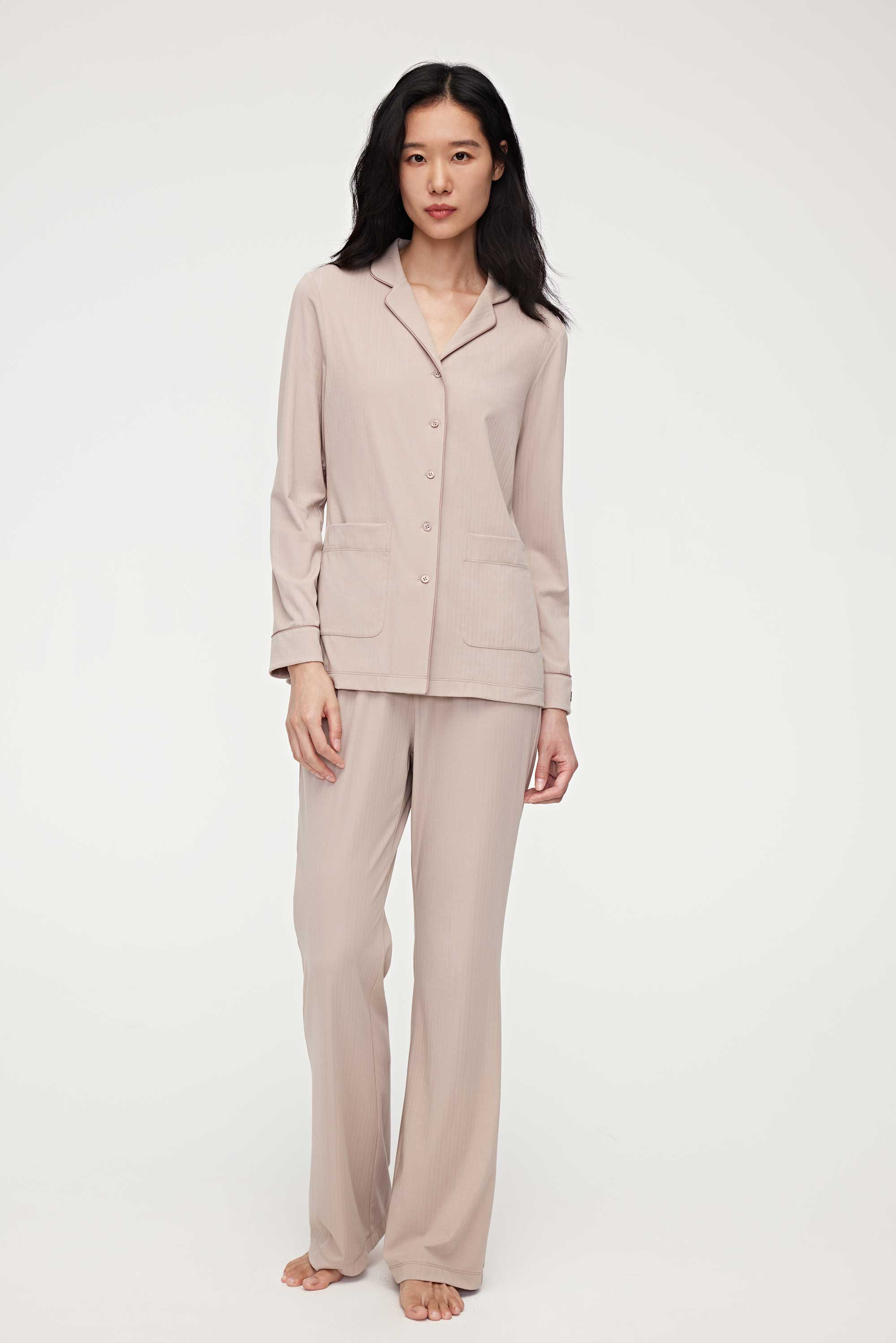 woman in coffee button up pajama set