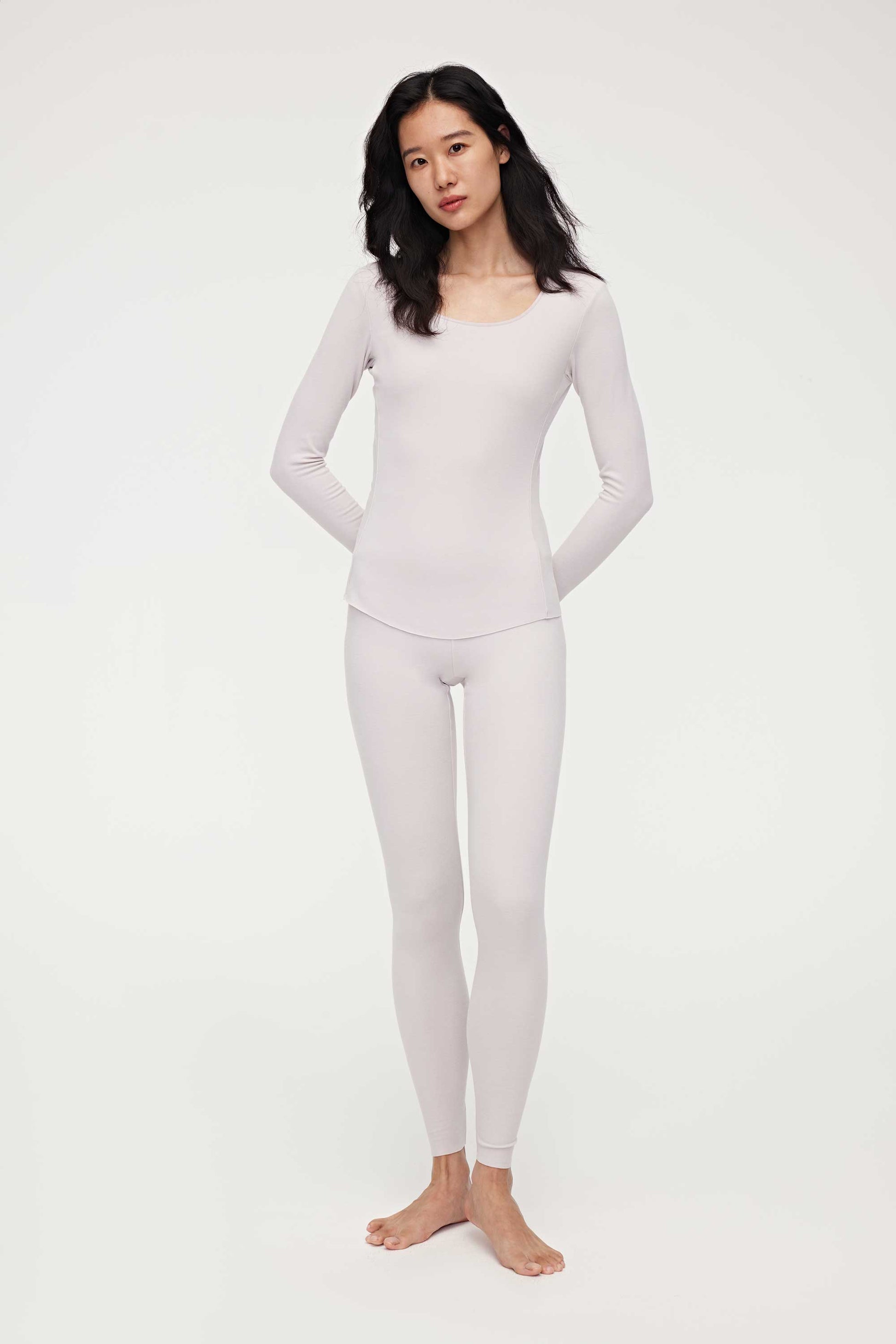 woman in light pink thermal wear set