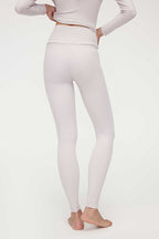 back of woman in light pink thermal pants