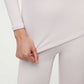 close up of woman in light pink thermal wear set