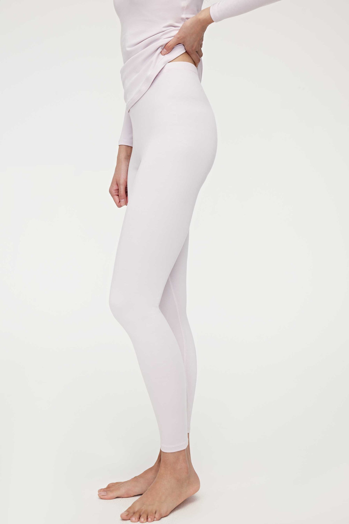 woman in light pink thermal pants