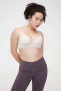 Woman wearing cream bra