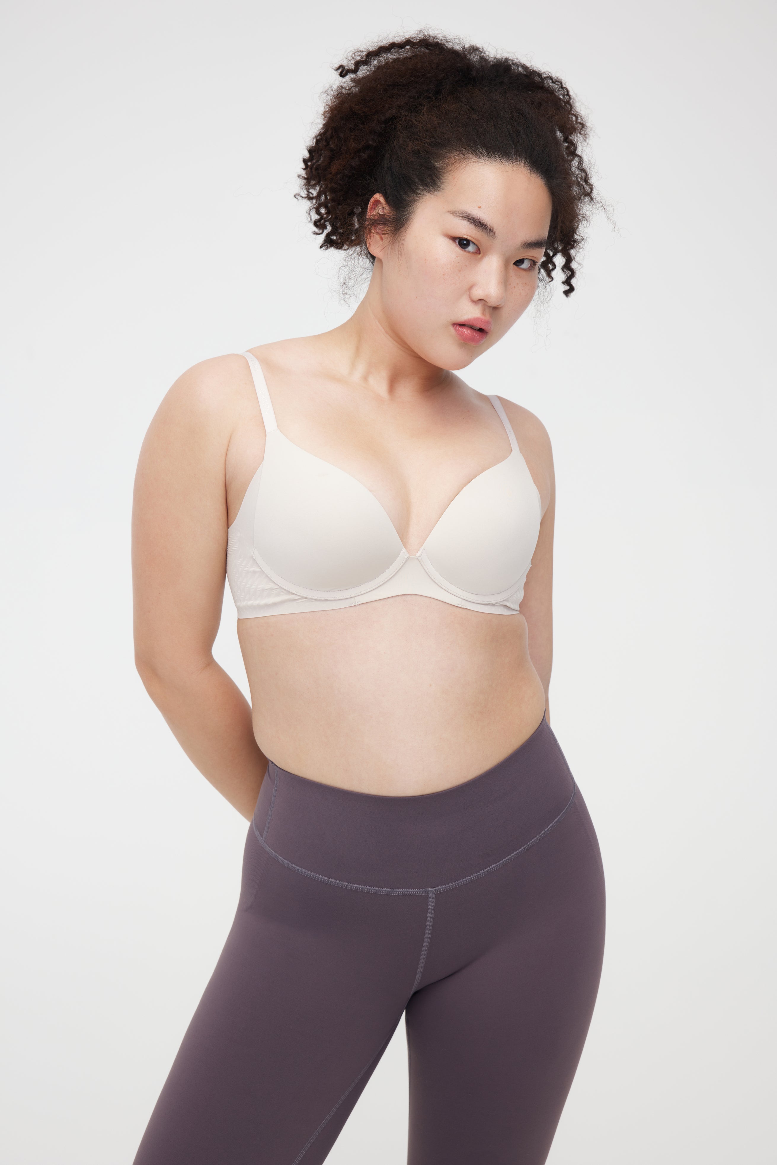 Woman wearing cream bra