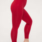 side view of woman in red thermal pants
