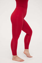 side view of woman in red thermal pants
