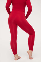 back of woman in red thermal pants