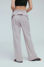 back of a woman wearing a grey joggers