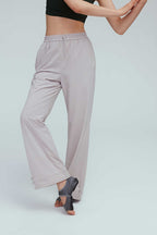 a woman wearing a grey joggers