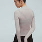 back of a woman wearing a light grey ballet wool shirt