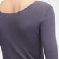 back of woman in purple v neck sweater