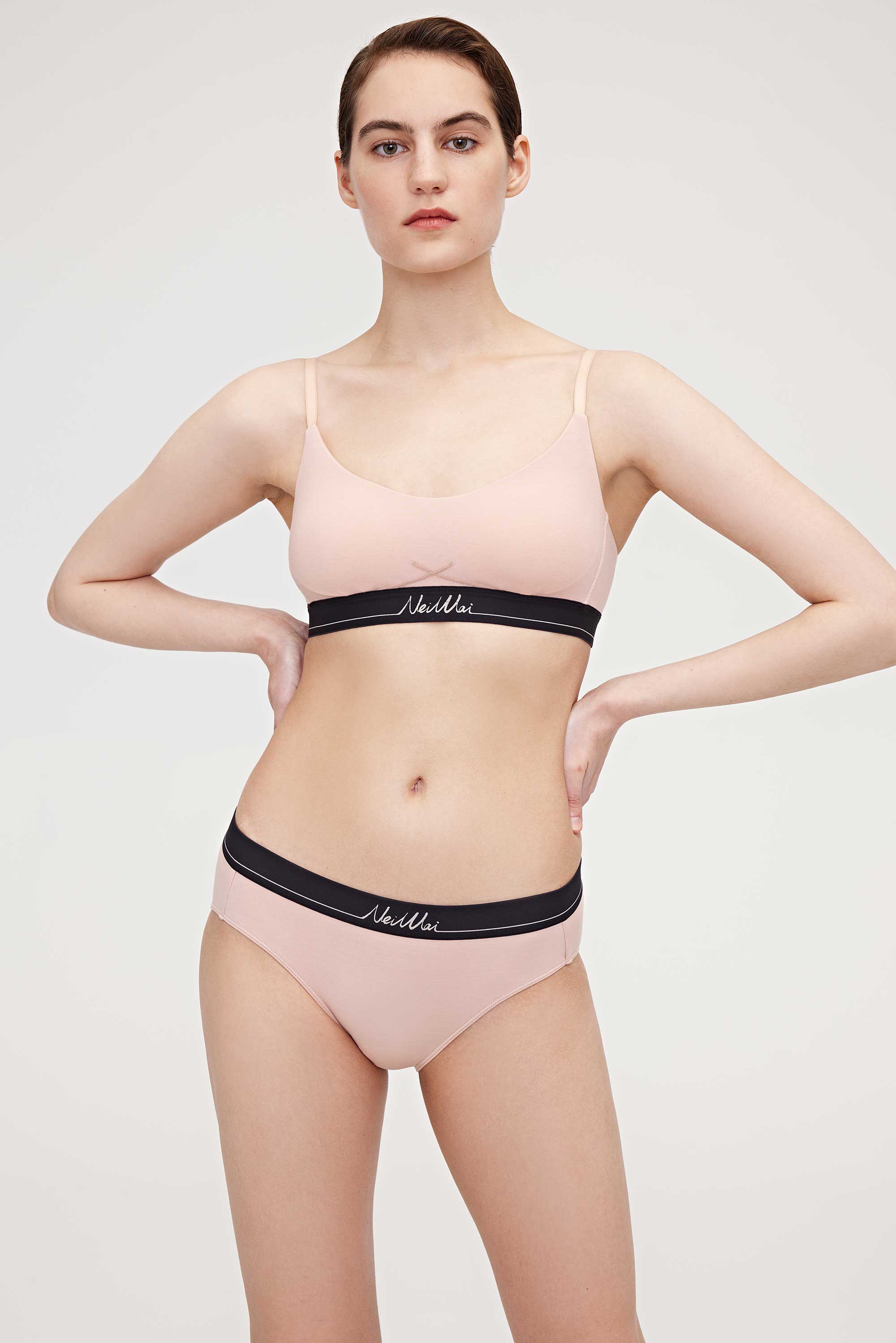woman in pink bra and brief