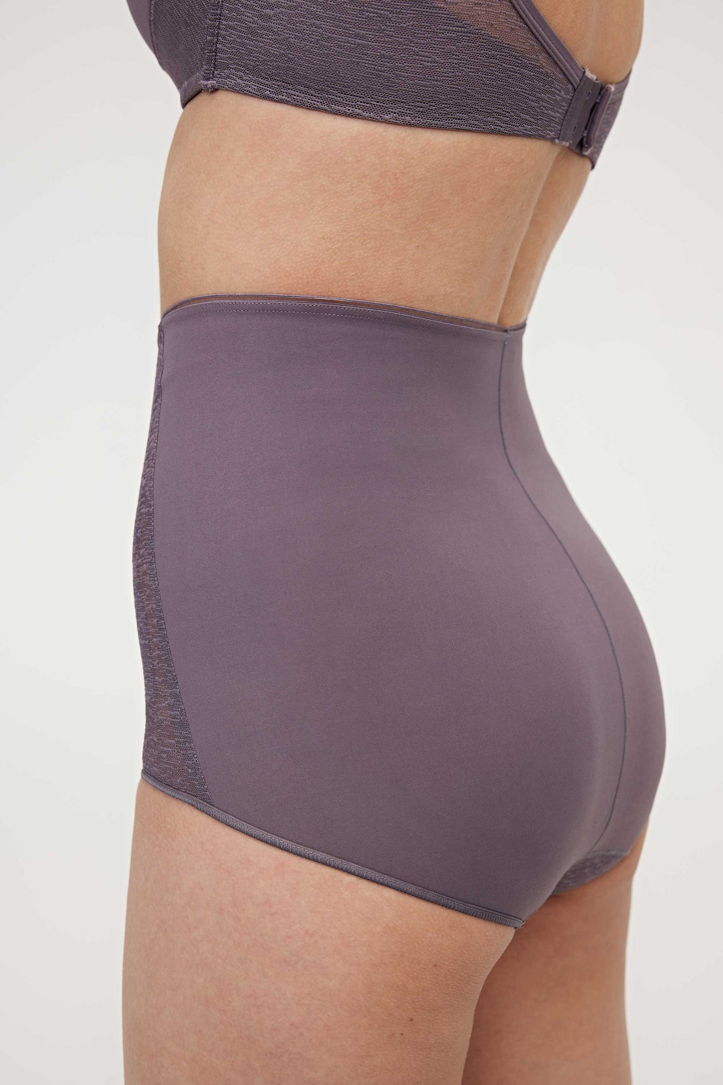 woman in purple high waist brief