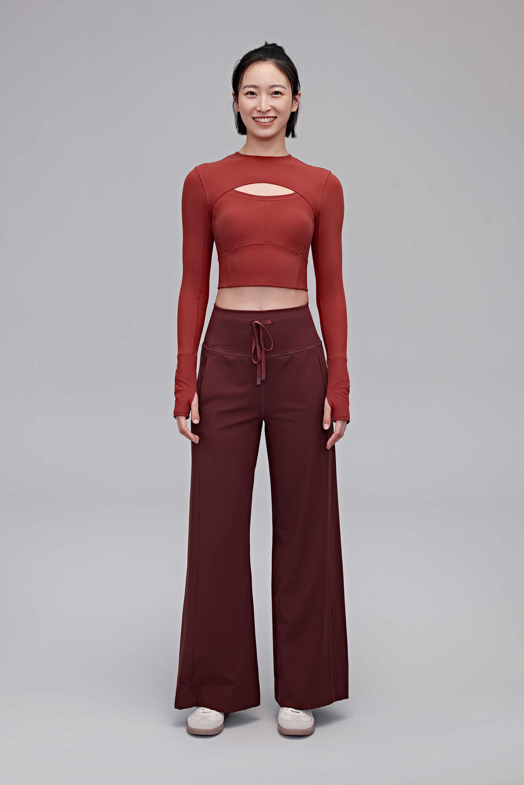 A woman wearing a red top and red pants